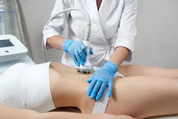 Lost the Weight but Not the Loose Skin? 2 woman having HIFU treatment on her stomach to combat loose skin Colchester following weight loss